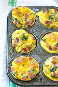 several muffins with ham and spinach in a pan