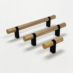 three black and gold benches on white background