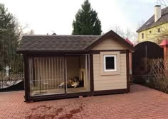 a small dog house sitting on top of a brick patio