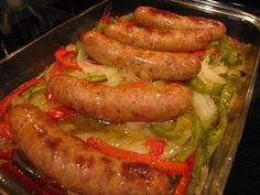 sausages and peppers are cooking in the oven