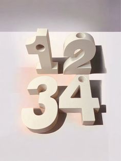 the letters and numbers are made out of wood