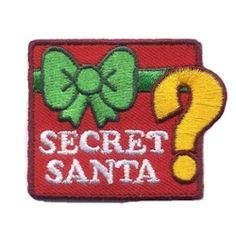 a patch with the words secret santa and a question mark