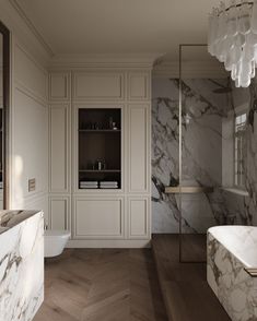 a bathroom with marble walls and flooring next to a bathtub in the corner