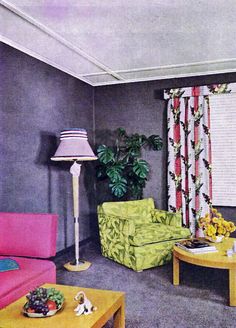 a living room with two couches and a table in front of a window filled with curtains