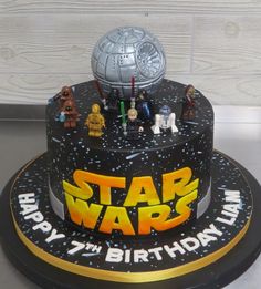 a star wars birthday cake with legos on top