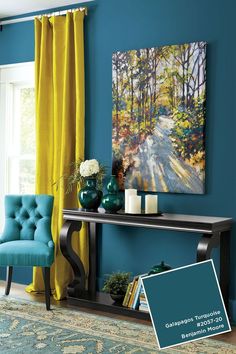 a living room with blue walls and yellow curtains