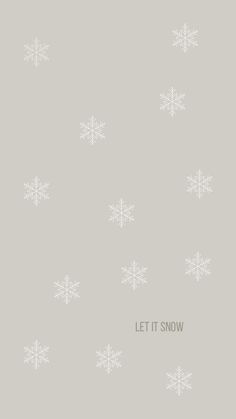 the words let it snow written in white on a gray background with snowflakes