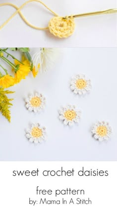 crochet flowers are arranged on a white surface next to yellow and white flowers