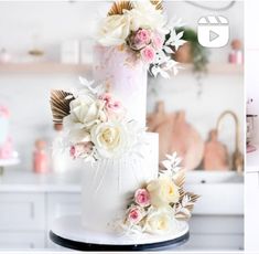 two different pictures of a wedding cake with flowers on it and the same photo in front of them