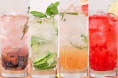 four different types of drinks lined up on a table