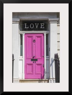 a pink door with the word love painted on it