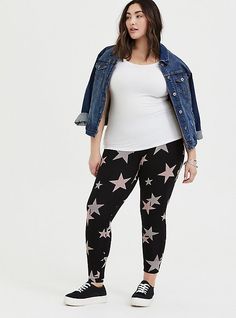 Our highly rated and expertly designed legging has a stretch waistband that holds you in with a tummy-smoothing effect and features an allover starry pattern print. High waist. Wide stretch waistband. Tapered leg. Opaque - never see through. CONTENT + CARECotton/spandex. Wash cold; dry low. Imported plus size leggings. SIZE + FITModel is 5’10”, size 1. 27” inseam. The best plus size women's full length signature waist premium legging black leggings in mega star made of premium. Rock your look fr Ruched Leggings, Tunic Hoodie, Camo Designs, Embroidered Cardigan, Black Tie Dye, Plus Size Leggings, Tapered Pants, Black Laces, Black Leggings