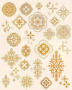 an orange and white pattern is shown on the back of a sheet of paper with gold foil