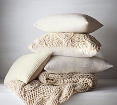 four pillows stacked on top of each other