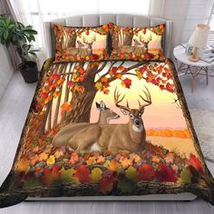 a bed with two deers and autumn leaves on it