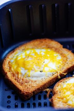 an egg and toast sandwich on a grill with the words, air fried egg and toast