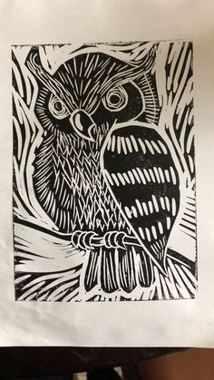 an owl is shown in black and white on a piece of paper that has been drawn