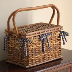 a wicker basket sitting on top of a wooden table