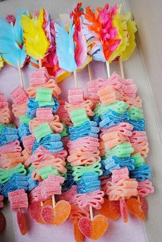 colorful lollipops are arranged on sticks