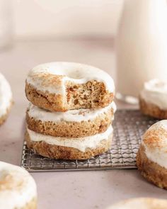 cinnamon donuts with white frosting on a cooling rack