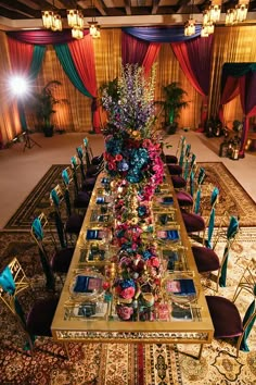 an elaborately decorated dining table with purple chairs