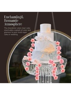 a white wedding cake with pink flowers hanging from it's sides and the words enchanting & romantic atmosphere