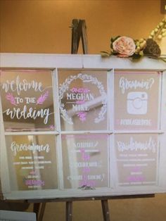 an easel with wedding signs on it