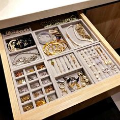 an open drawer filled with lots of jewelry