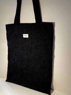 Gorgeous black  corduroy tote bag, corduroy tote bag, everyday tote bag. Fully lined in a black cotton. Fits a laptop, notebook etc. Simple, stylish and soft. Generously sized with plenty of space for all your daily essentials and more. Perfect for commuting to college, out and about shopping, or a catch-up with the girls. Machine washable at 30 degrees. Handmade with love in Ireland 🇮🇪  Bag dimensions are as follows- Width  - 33 cm Length- 42 cm Strap from top of bag - 37cm Everyday Corduroy Canvas Tote Bag, Everyday Corduroy Tote Canvas Bag, Black Cotton Shoulder Bag For Daily Life, Corduroy Tote Bag For Everyday Use, Everyday Corduroy Tote Bag, Everyday Rectangular Corduroy Canvas Bag, Everyday Rectangular Corduroy Bag, Rectangular Corduroy Everyday Bag, Rectangular Everyday Corduroy Bag