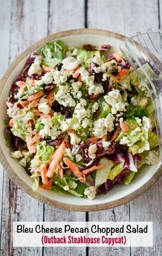 a salad in a bowl with the words bleu cheese pecan chopped salad