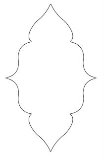 the outline of an ornate design for a wall hanging ornament, with a white background