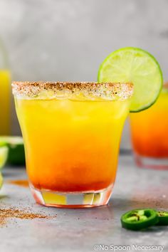 the spicy sunset margarita on the rocks is ready to be served