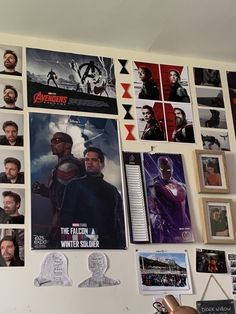 the avengers movie posters are hanging on the wall