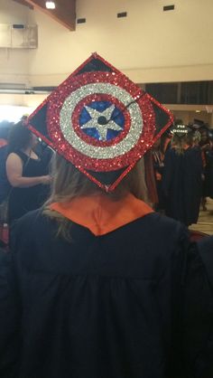 a woman wearing a captain america cap with sequins on it's back