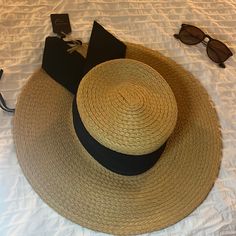 Brand New Adjustable, Soft, Beach Hat With Black Band. Casual Adjustable Straw Hat For Poolside, Chic Straw Hat For Beach Season Travel, Chic Straw Hat For Travel And Beach Season, Casual Adjustable Panama Hat For Poolside, Casual Boater Hat For Beach Season Travel, Chic Sun Hat For Vacation Travel, Chic Sun Hat For Travel And Vacation, Chic Lightweight Panama Hat For Vacation, Trendy Wide Brim Straw Hat For Poolside