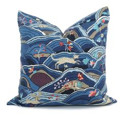 a blue pillow with an animal design on it