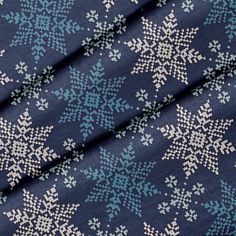 a blue and white snowflake print fabric