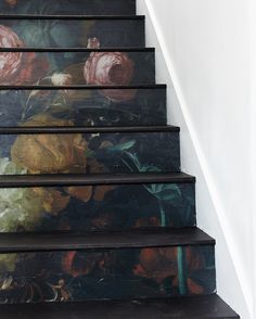 the stairs are painted with flowers on them and there is no image above it to describe