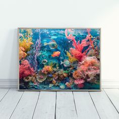 an underwater scene with corals and fish in the water, framed on a wall