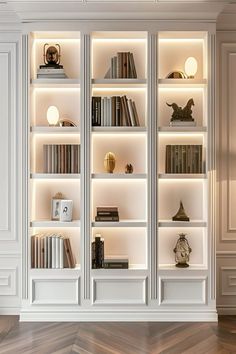 a white bookcase with many books on it