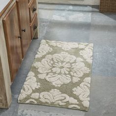 a bathroom with a rug on the floor