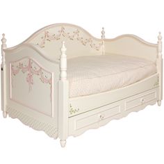 a white bed with drawers underneath it on a white floor and wall behind it is an image of a child's bed that has pink trim around the headboard and foot board