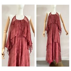 "Beautiful vintage party halter dress from the 1970s Made from a burgundy red silk chiffon fabric with a lining in the inside The dress closes at the back with a buttons UK size: 6 (xs) - US: 4 EU: 34 Measurements measured flat: Pit to pit: 43 cm - 16.9\" Length: 133 cm - 52,4\" Waist: 34 cm - 13,4 Hips: 46 cm - 18,1 Material: chiffon silk with an synthetic lining In perfect condition This item has been washed and steamed so that there are no more unpleasant odors This item is vintage, which mea Red Halter Dress, Maxi Party Dress, Silk Chiffon Fabric, Dress With Open Back, Vintage Party, Red Silk, Maxi Dress Party, Silk Chiffon, Chiffon Fabric