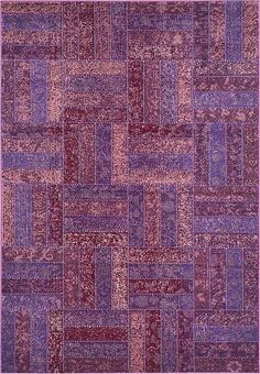 an area rug with many different colors and patterns on the carpet, including pinks, purple