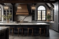 a large kitchen with marble counter tops and black cabinets