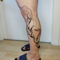 a person with a tattoo on their leg