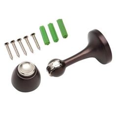 an assortment of knobs and screws on a white background, including green handles