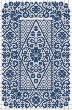 a cross stitch pattern with blue and white designs on the bottom, in front of a ruler