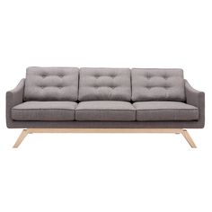 a gray couch sitting on top of a wooden frame