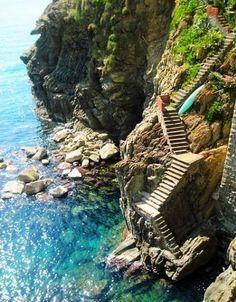 stairs leading down to the ocean from a cliff